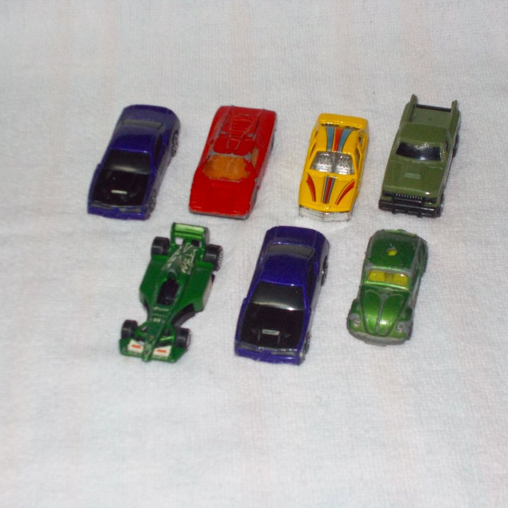 A set of seven cars, various brands.